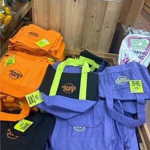 FOUR: Trader Joe's Tote Bags in Orange, Black, and Purple